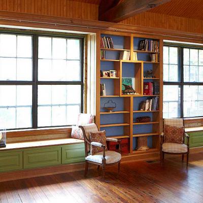 carriage house in white oak and lacquered maple with built-in maple library and window seats