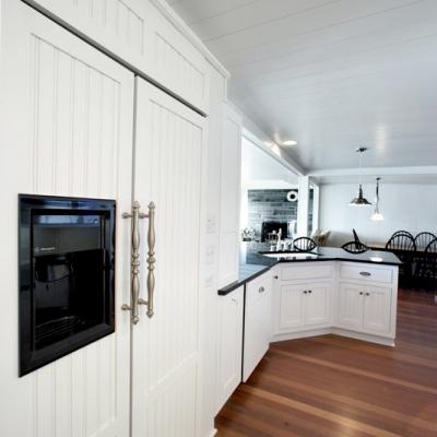 paneled refrigerator cottage kitchen in white